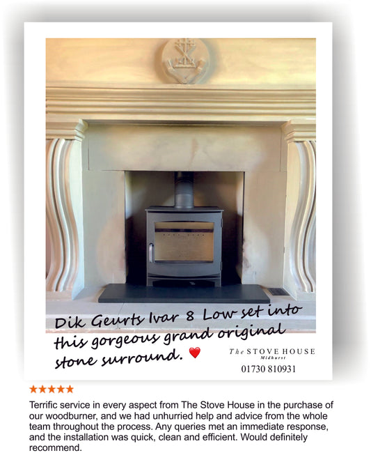 A Dik Geurts Ivar 8 Low woodburner installation into a stone fireplace surround