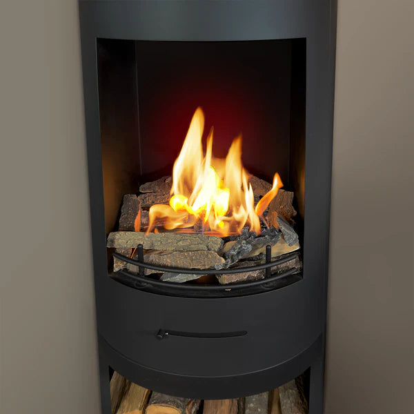 Stack of bioethanol luxury painted ceramic firewood on displayed in a bioethanol freestanding cylindrical modern stove firebox