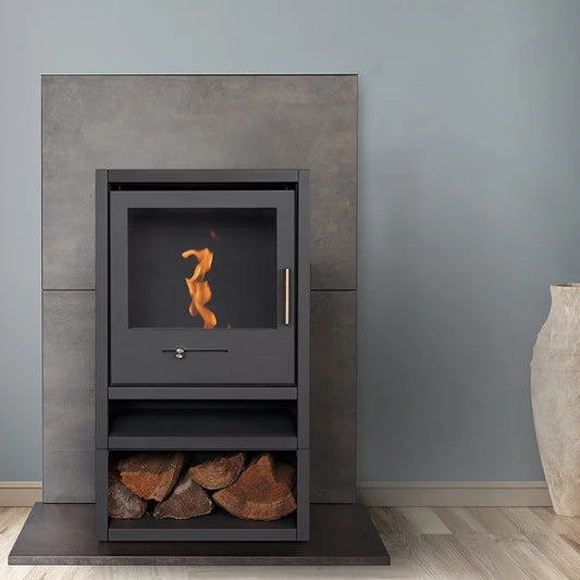 OKO S1 Freestanding Bioethanol Stove with Log Store & Flue Pipe in Charcoal Grey requires no flue/chimney at the Stove House Ltd. West Sussex.