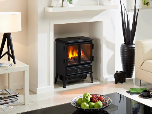 Dimplex Oakhurst Optimyst Electric Stove. Integrated heater which provides up to 2kW of heat that can be operated via manual or remote control with a thermostat at The Stove House Ltd. West Sussex.