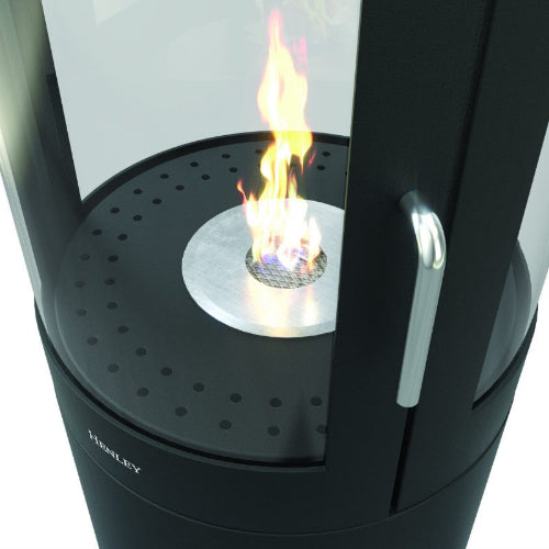 The Henley Berlin Cylindrical Bioethanol Stove. Modern in design, with a 360-degree view through a three-panelled glass exterior at The Stove House Ltd. West Sussex.