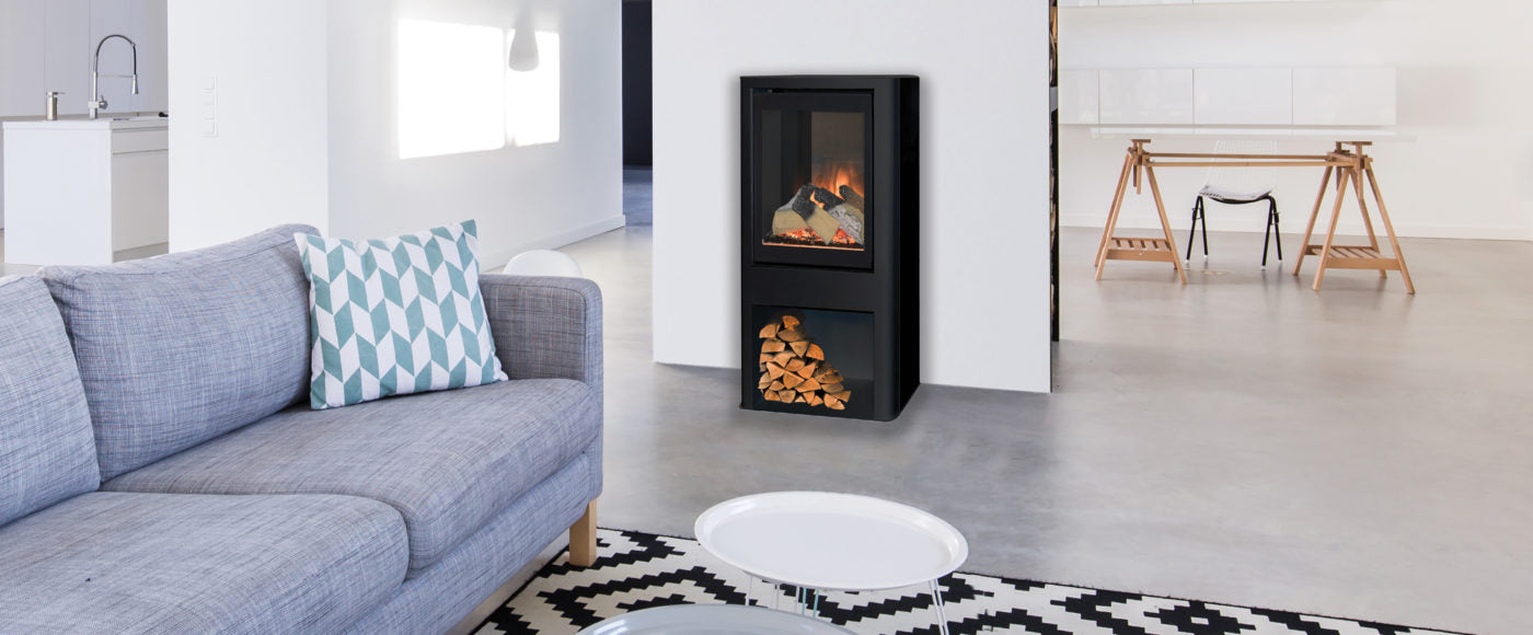 Evonic Tuva Evoflame modern electric stove with a log store and large glass window with realist flame effect. The Stove House Midhurst Nr Chichester West Sussex