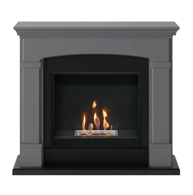 Helmi Bioethanol Fireplace Suite - Grey. Crafted from MDF with a classic grey finish, the Helmi fireplace is equipped with a bioethanol burner with a capacity of 2 litres, providing up to 5-6 hours of burn time and a heat output of up to 3 kW, at The Stove House Ltd. West Sussex.