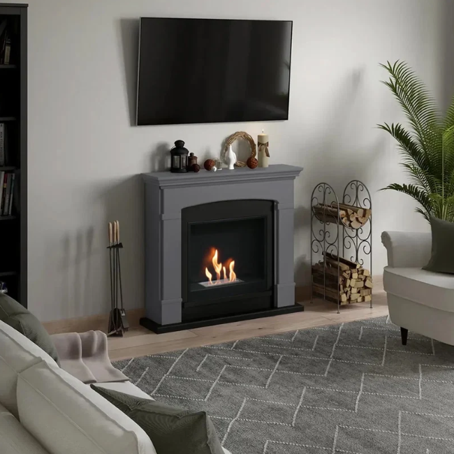 Helmi Bioethanol Fireplace Suite - Grey. Crafted from MDF with a classic grey finish, the Helmi fireplace is equipped with a bioethanol burner with a capacity of 2 litres, providing up to 5-6 hours of burn time and a heat output of up to 3 kW, at The Stove House Ltd. West Sussex.