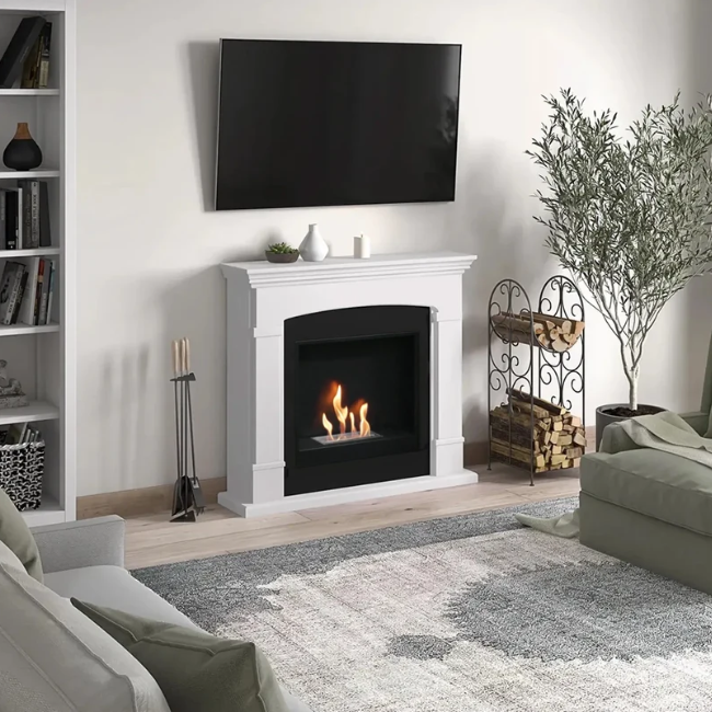 Helmi Bioethanol Fireplace Suite - White. Crafted from MDF with a classic white finish, the Helmi fireplace is equipped with a bioethanol burner with a capacity of 2 litres, providing up to 5-6 hours of burn time and a heat output of up to 3 kW, at The Stove House Ltd. West Sussex.