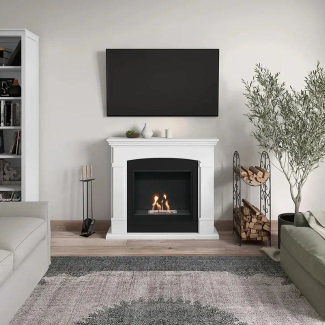 Helmi Bioethanol Fireplace Suite - White. Crafted from MDF with a classic white finish, the Helmi fireplace is equipped with a bioethanol burner with a capacity of 2 litres, providing up to 5-6 hours of burn time and a heat output of up to 3 kW, at The Stove House Ltd. West Sussex.