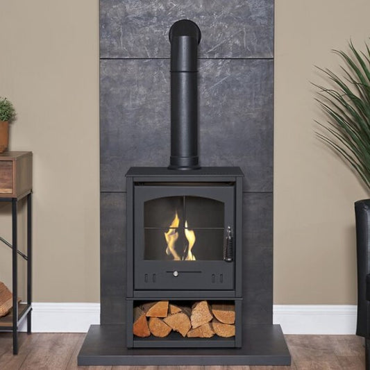 OKO S2 Freestanding Bioethanol Stove with Log Store and Flue Pipe in Charcoal grey requires no flue/chimney at the Stove House Ltd. West Sussex.