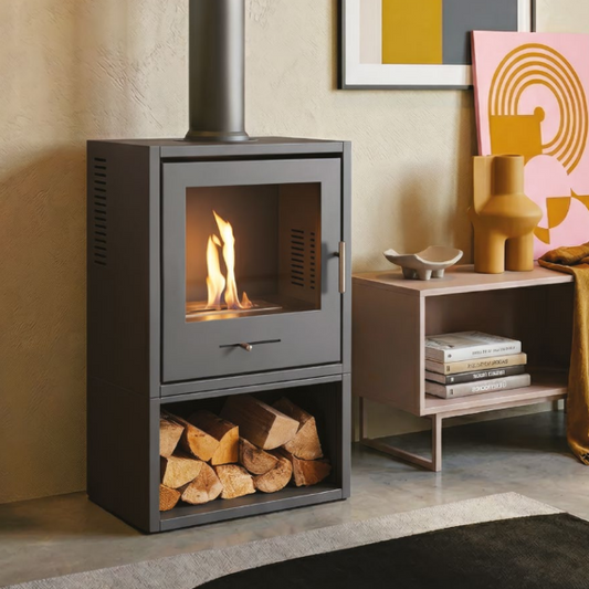 OKO S3 BIOETHANOL STOVE WITH LOG STORE. A medium-sized bioethanol stove in charcoal grey with a wide viewing window and log store base, with up to 3 kW output at The Stove House Ltd. West Sussex.