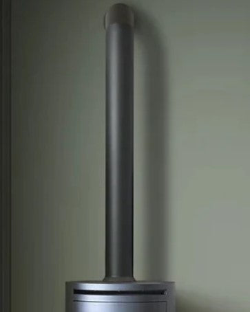 A grey box like structure made of steel that has a metal chamber inside that houses BIOETHANOL fuel. A 100% eco friendly renewable energy resource that's been turned into liquid. This is put into the metal chamber inside the fire box and lite to produce real flames and real heat and no chimney is required.