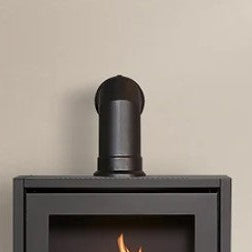 A grey box like structure made of steel that has a metal chamber inside that houses BIOETHANOL fuel. A 100% eco friendly renewable energy resource that's been turned into liquid. This is put into the metal chamber inside the fire box and lite to produce real flames and real heat and no chimney is required.