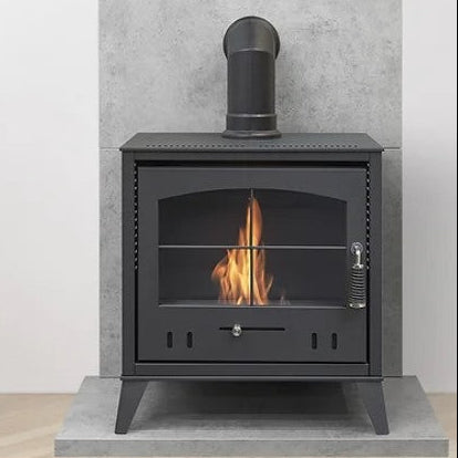An OKO S4 BIOETHANOL STOVE WITH SHORT ANGLED FAKE FLUE SITTING ON TOP, PRICED AT £483.99 that burns Bio ethanol fuel. Its a flueless traditional woodburner style fire with a large glass door and tacery on it. The flames produce 3kW in heat and looks very cosy and inviting. It has No chimney or flue as one isn't needed and its from The Stove House
