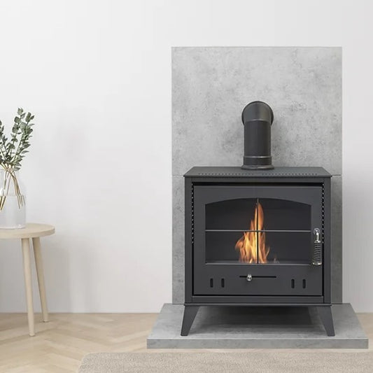 An OKO S4 BIOETHANOL STOVE WITH SHORT ANGLED FAKE FLUE SITTING ON TOP, PRICED AT £483.99 that burns Bio ethanol fuel. Its a flueless traditional woodburner style fire with a large glass door and tacery on it. The flames produce 3kW in heat and looks very cosy and inviting. It has No chimney or flue as one isn't needed and its from The Stove House