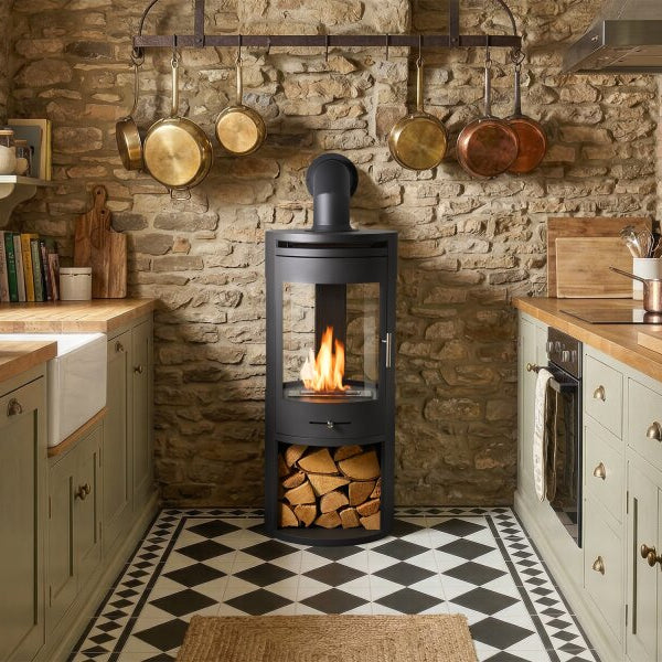 The OKO S7 bio ethanol panoramic stove in charcoal grey offers the brilliance of a real, open flame system for up to 8 hours. A heat output of up to 3kW. No direct flue or chimney required at The Stove House Ltd. West Sussex.