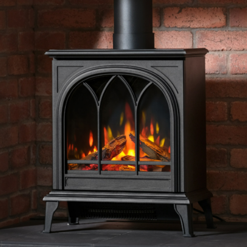 Wildfire Ravel 400TE Electric Stove. Utilizing the latest LED technology that creates an impressive, realistic flame picture with glowing logs at The Stove House Ltd. West Sussex.