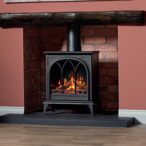 Wildfire Ravel 400TE Electric Stove. Utilizing the latest LED technology that creates an impressive, realistic flame picture with glowing logs at The Stove House Ltd. West Sussex.