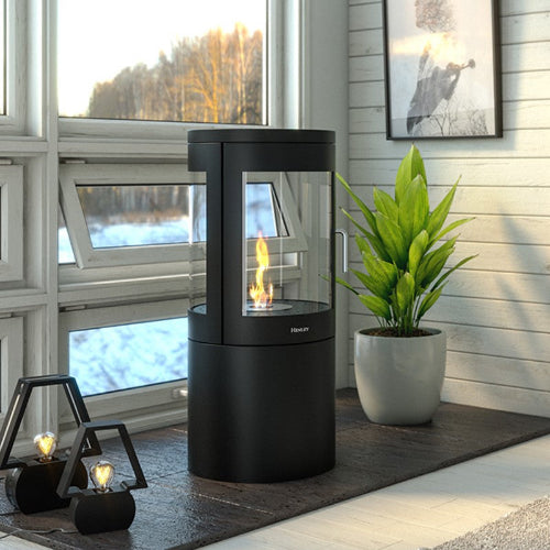 The Henley Berlin Cylindrical Bioethanol  Stove.  Modern in design, with a 360-degree view through a three-panelled glass exterior at The Stove House Ltd. West Sussex.