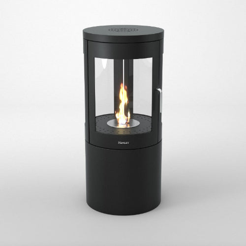 The Henley Berlin Cylindrical Bioethanol  Stove.  Modern in design, with a 360-degree view through a three-panelled glass exterior at The Stove House Ltd. West Sussex.